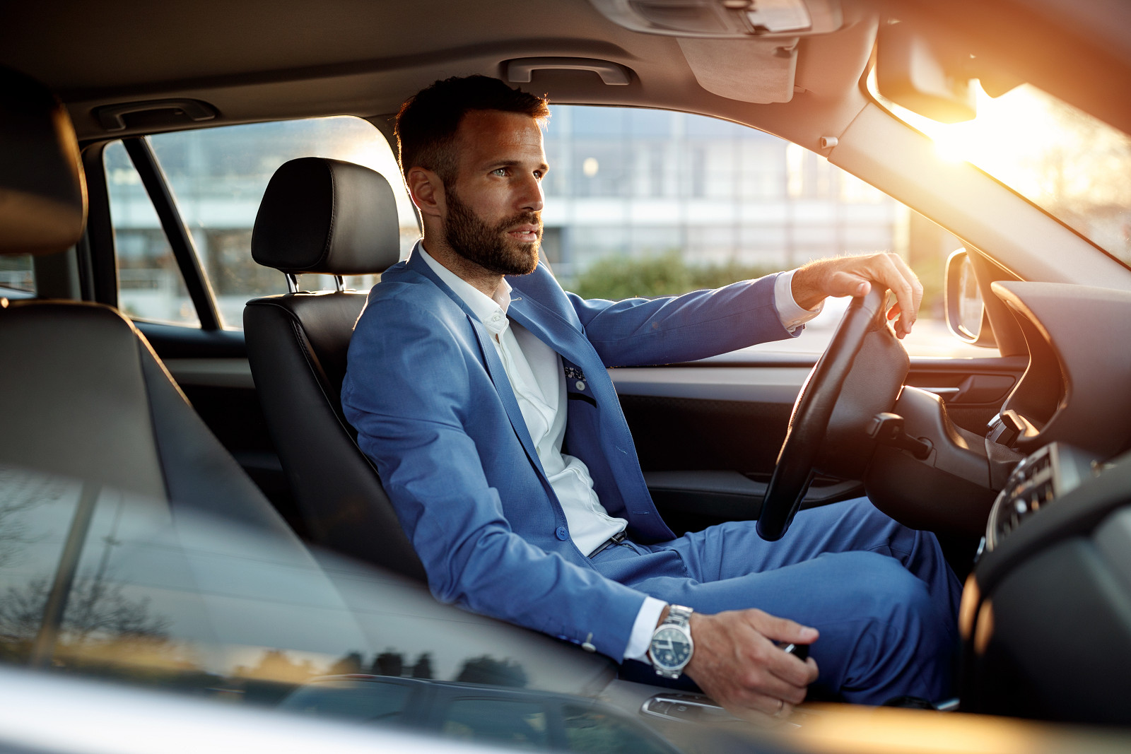 ALPHABET_attractive_man_driving_his_car_high.jpg